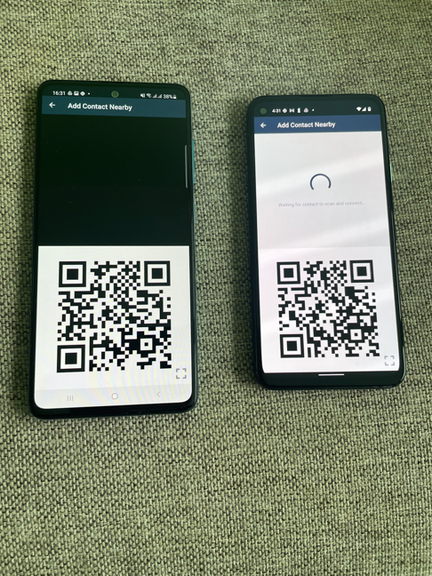 The smartphone on the right has scanned the QR code and is waiting for the device on the left to scan it as well