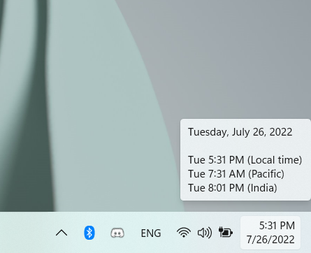 A tooltip displays the local time and additional clocks
