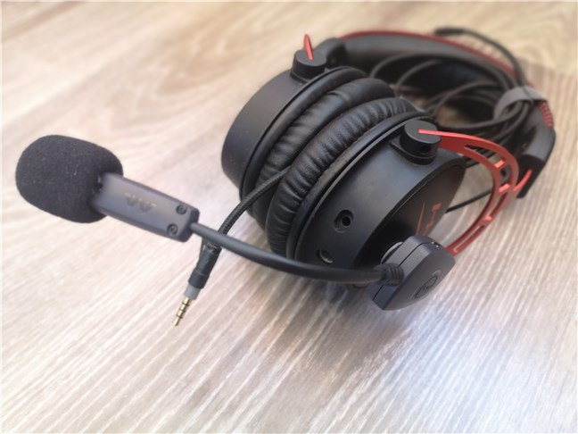 The Antlion Audio ModMic Wireless mounted on a headphones pair