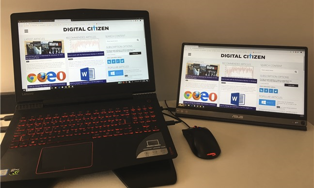 A portable monitor connected to a laptop using a USB-C cable