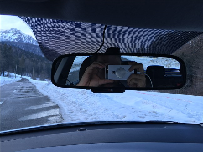 The MIO MiVue J60 positioned behind the rearview mirror