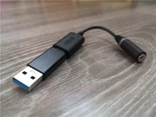 ASUS AI Noise-Canceling Mic dongle with the USB-A adapter