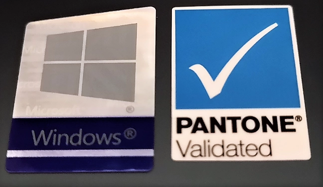 The Pantone Validated sticker on the back of a laptop