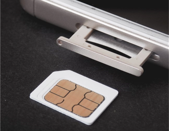 A SIM card and the SIM card tray of a phone