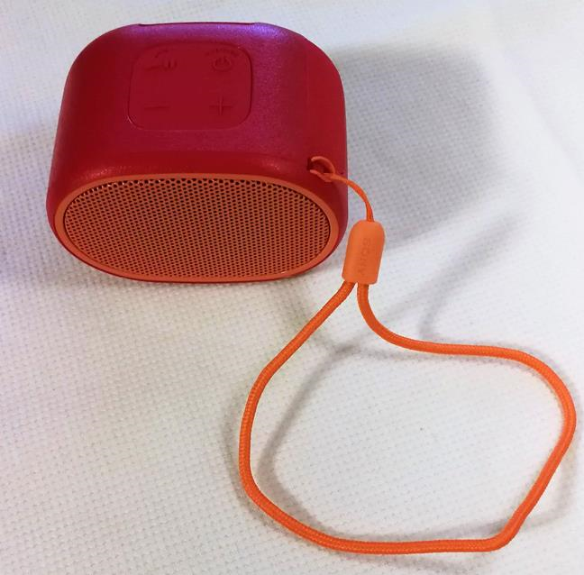 The Sony SRS-XB01 speaker with the strap attached