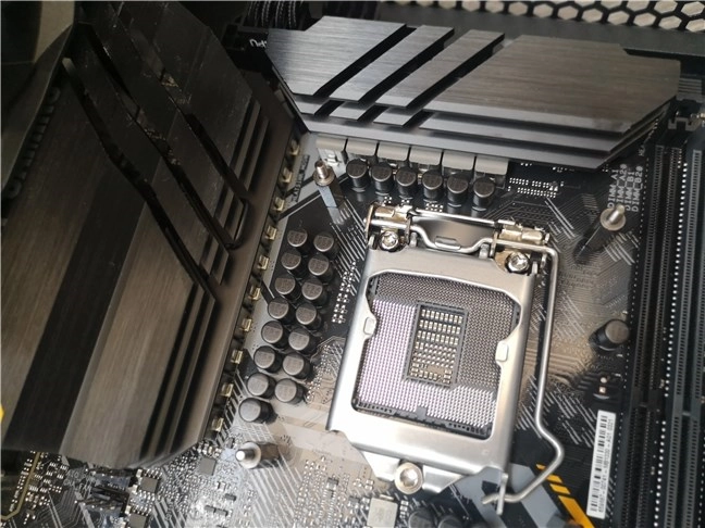 The large VRMs and heatsinks around the CPU socket