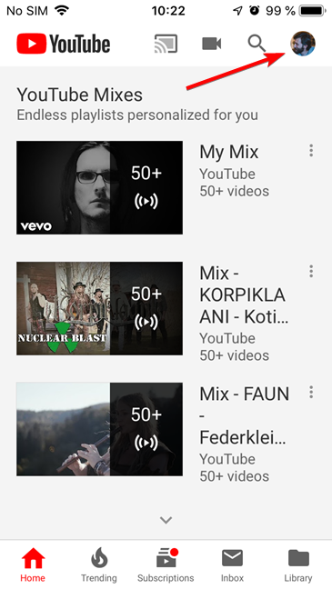 Tap the user account button in the YouTube app for iOS