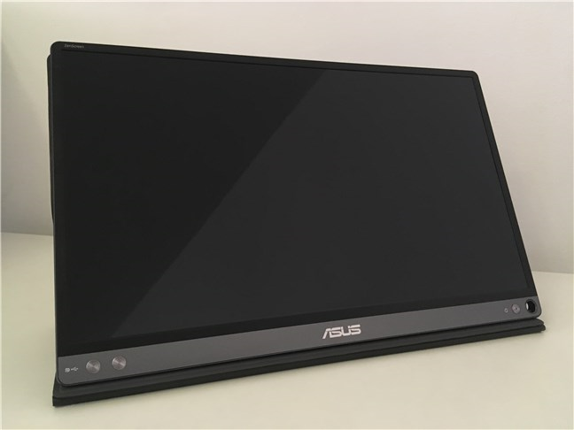 The ASUS ZenScreen MB16AC standing on its cover