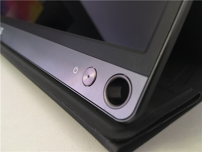 The power button and the pen hole found on the ASUS ZenScreen MB16AC