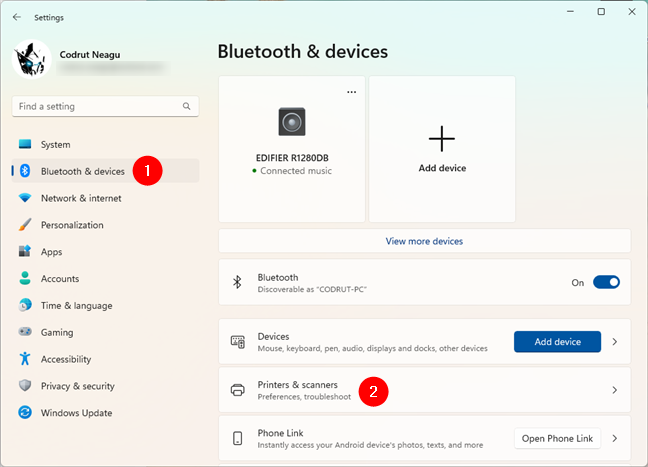 Go to Bluetooth & devices > Printers & scanners in Windows 11's Settings