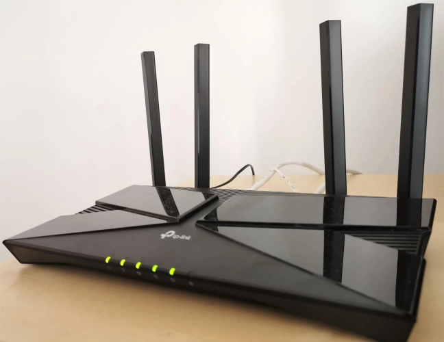 The LEDs on the front of the TP-Link Archer AX10