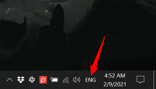 Press on the new abbreviated language icon to reveal the language bar in Windows 10