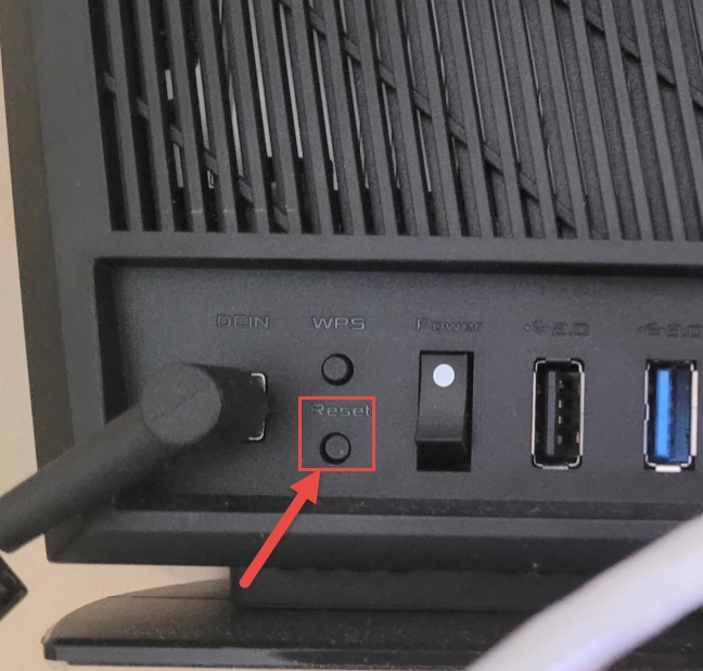 Use the Reset button on the back of your ASUS router