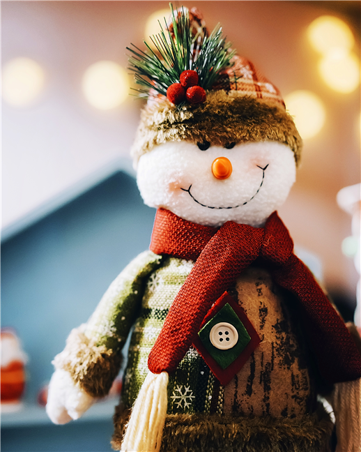 Smiling toy snowman by Di He
