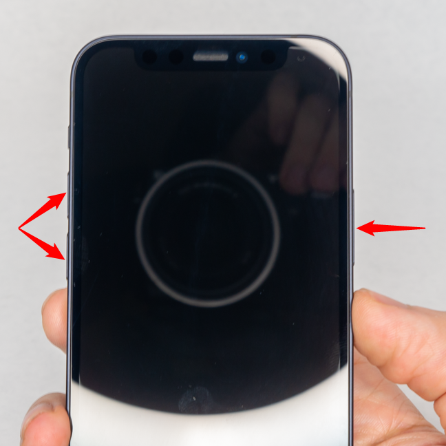 Press and hold one of the volume buttons and the side button to power off your iPhone