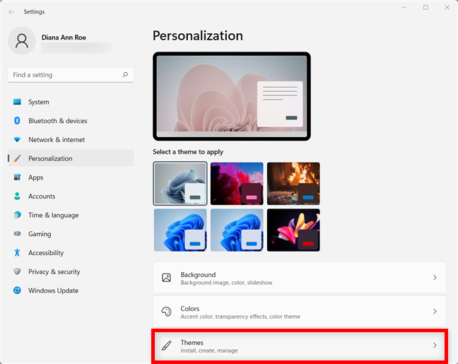 Click or tap on Themes from the Personalization tab in Windows 11