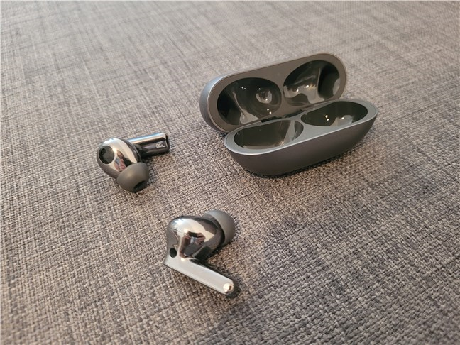 The Huawei FreeBuds Pro 2 next to their charging case