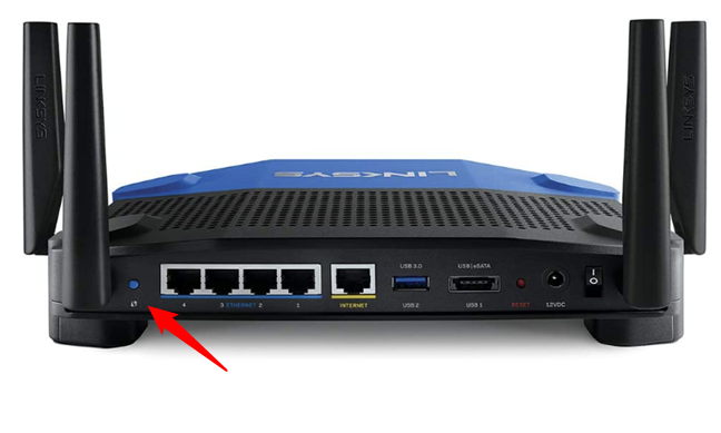 The router button labeled with the WPS symbol on a Linksys router