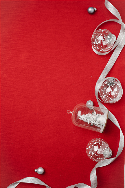 Christmas composition of glass baubles and ribbon by Laura James