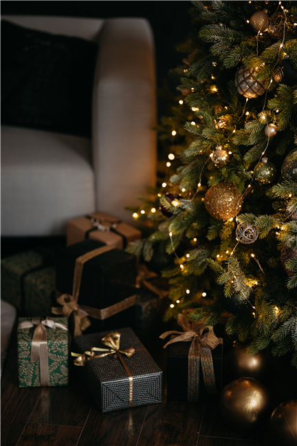 Gifts Under the Christmas Tree by an Armchair by Lisett KruusimÃ¤e