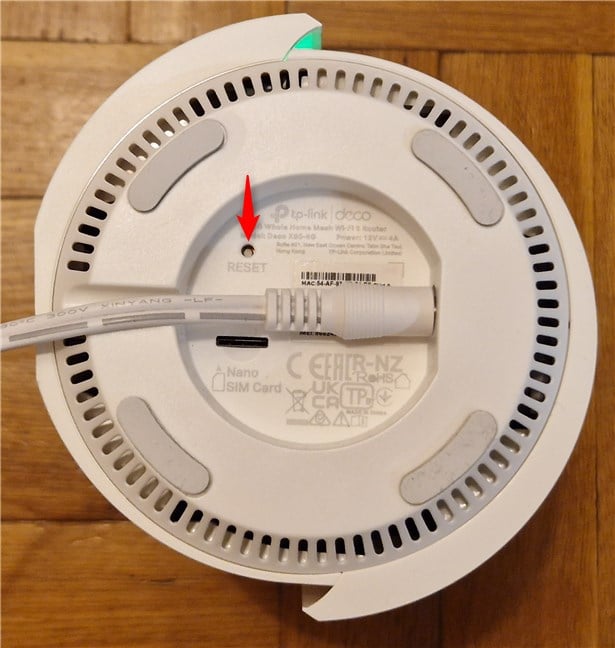 Reset button on a TP-Link Deco X80-5G