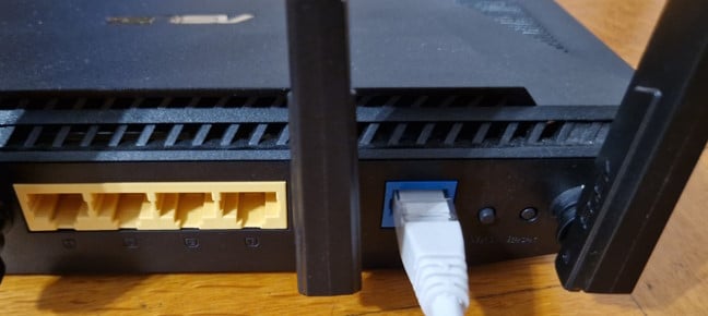 Plug the Ethernet cable into the WAN port of the secondary unit