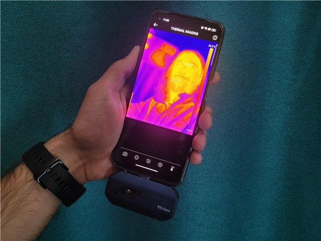 The Topdon TC001 thermal imaging camera on a smartphone