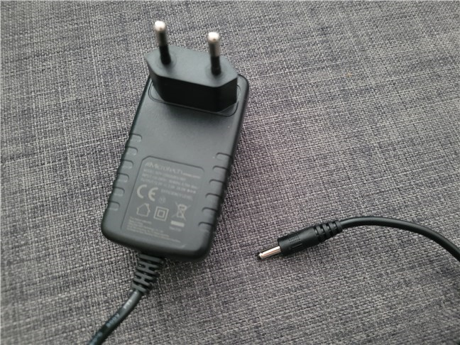 The power adapter uses a proprietary connector