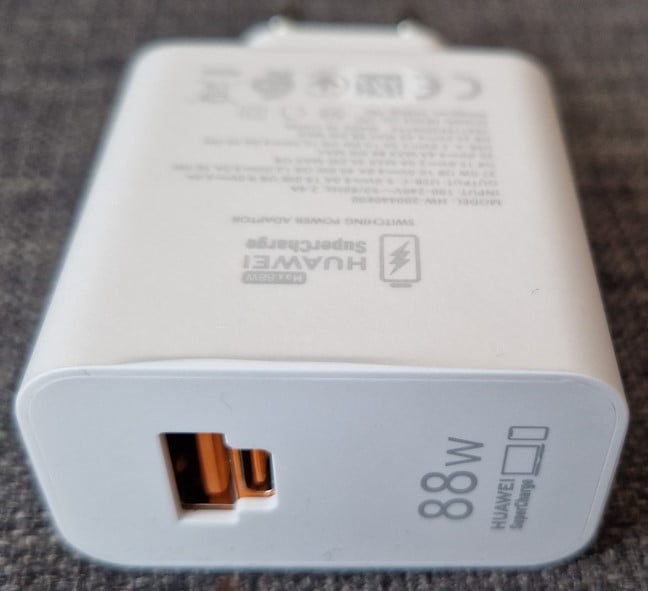 The 88 Watts fast charger comes with the phone