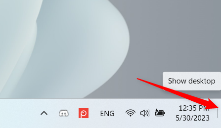 Use the thin button next to the clock to minimize all apps
