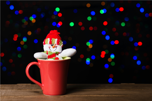 Snowman In Red Ceramic Mug by Daniel Reche