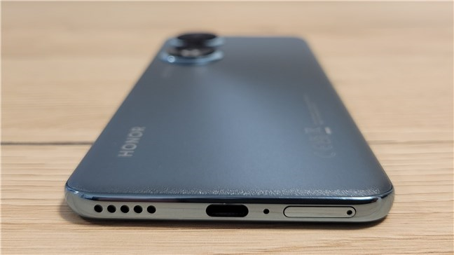 The bottom edge is home to the USB-C port, SIM tray, and loudspeaker