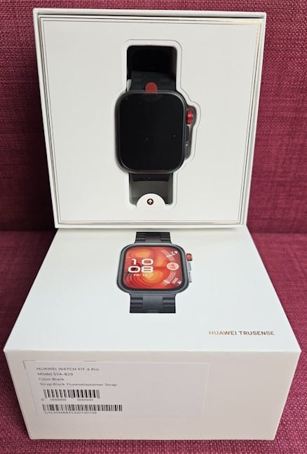 Opening the box reveals the smartwatch