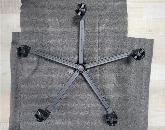 First, you put the wheels on the steel base