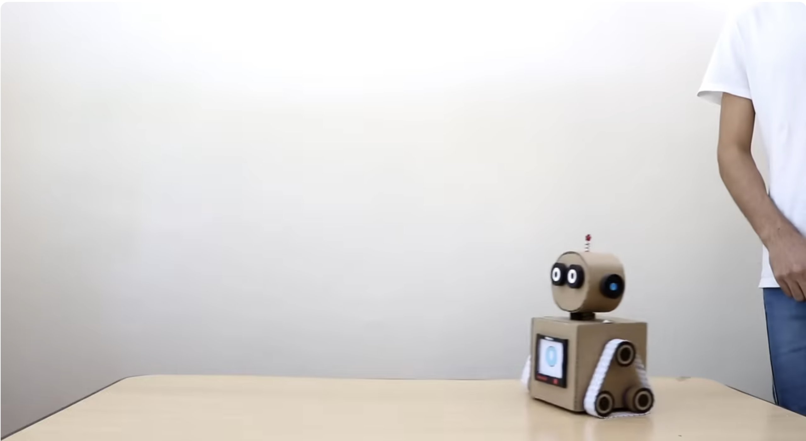 An image showing a man testing the robot
