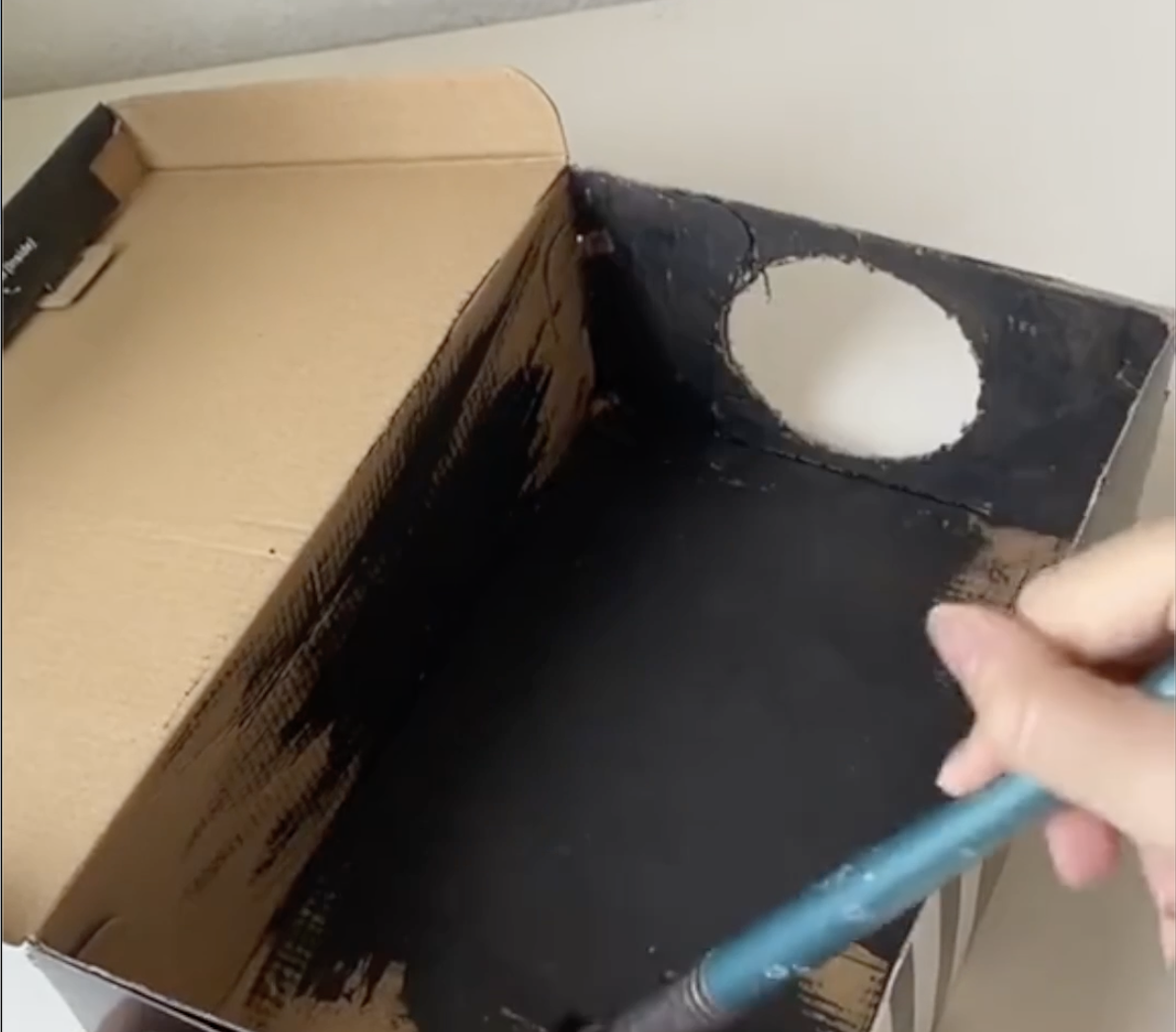 Painting the insides of the brown box black