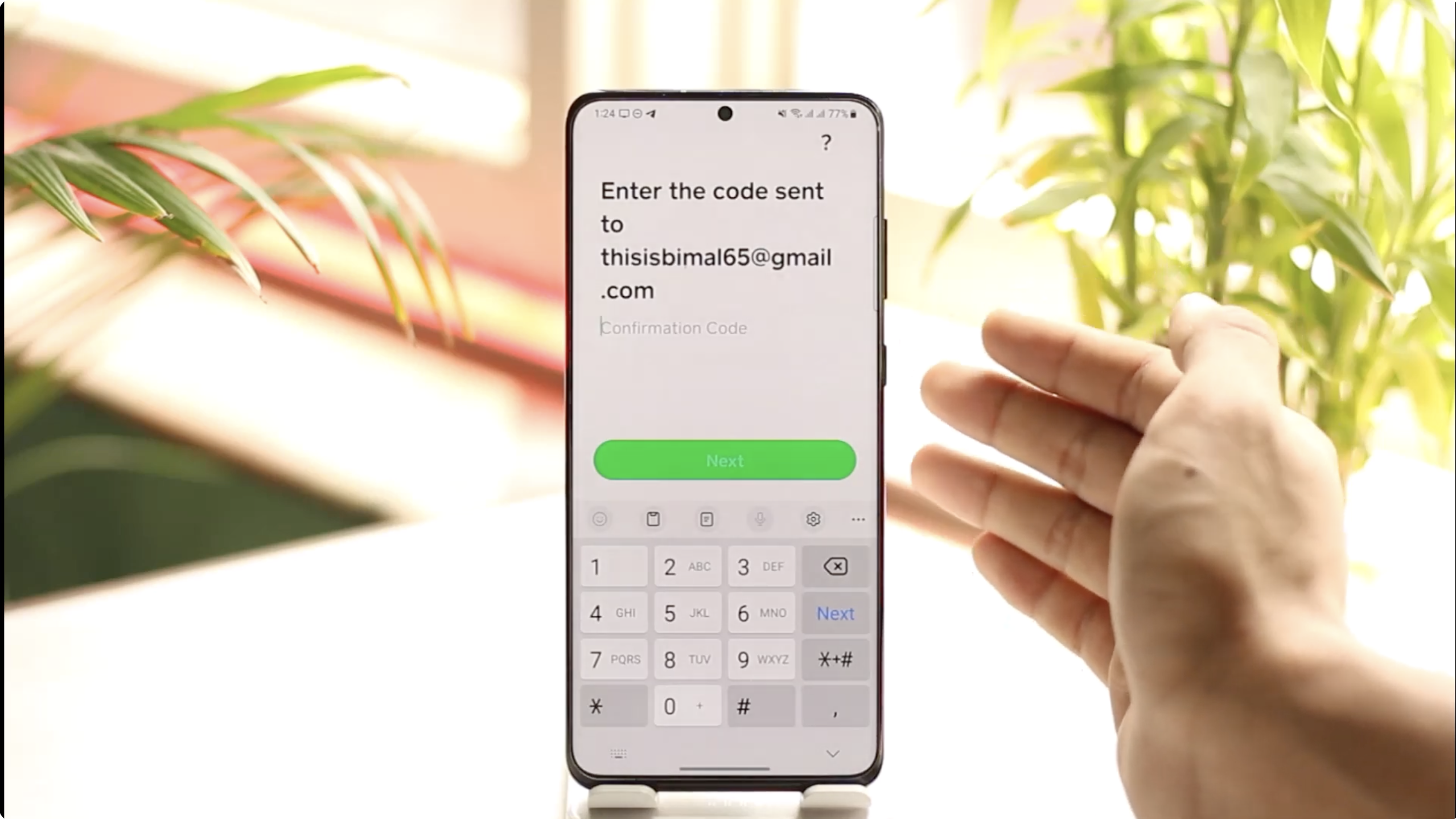 A person entering their phone number or email on the Cash App login screen