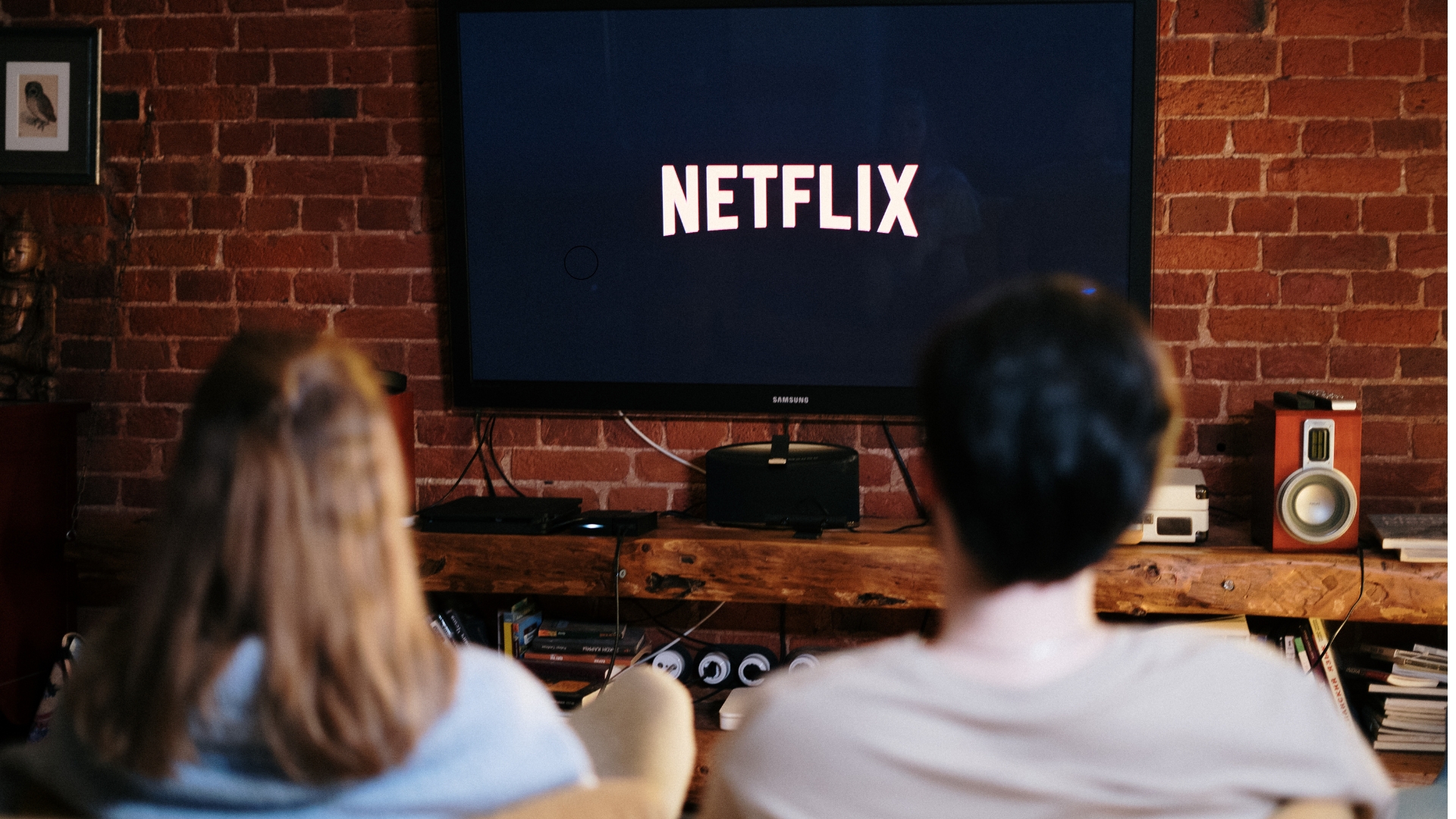 Black smart tv on wall with netflix channel