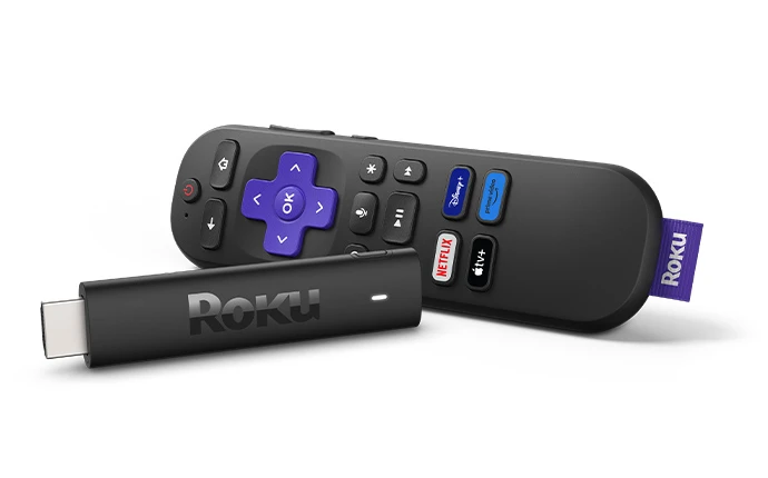Roku streaming stick beside remote
