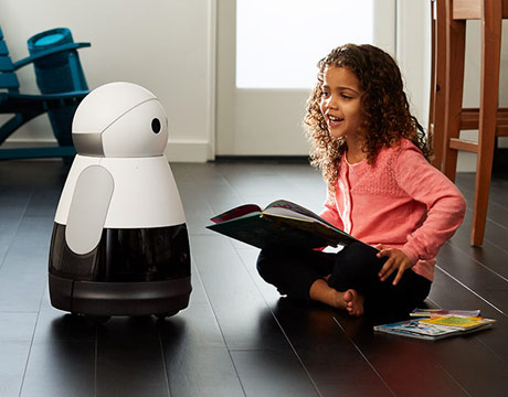 an educational robot standing beside a child
