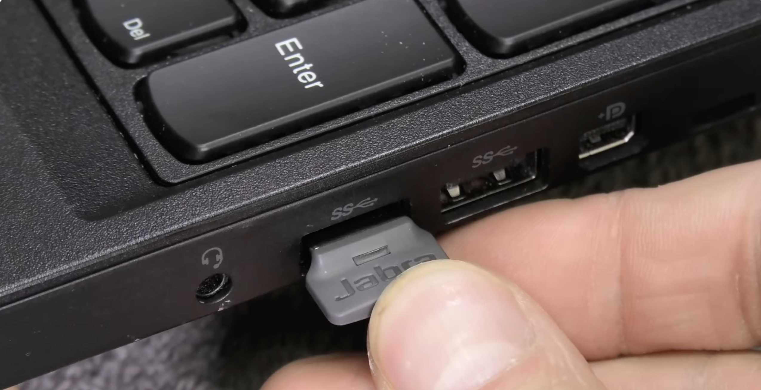 a picture of Jabra dong inserted into laptop