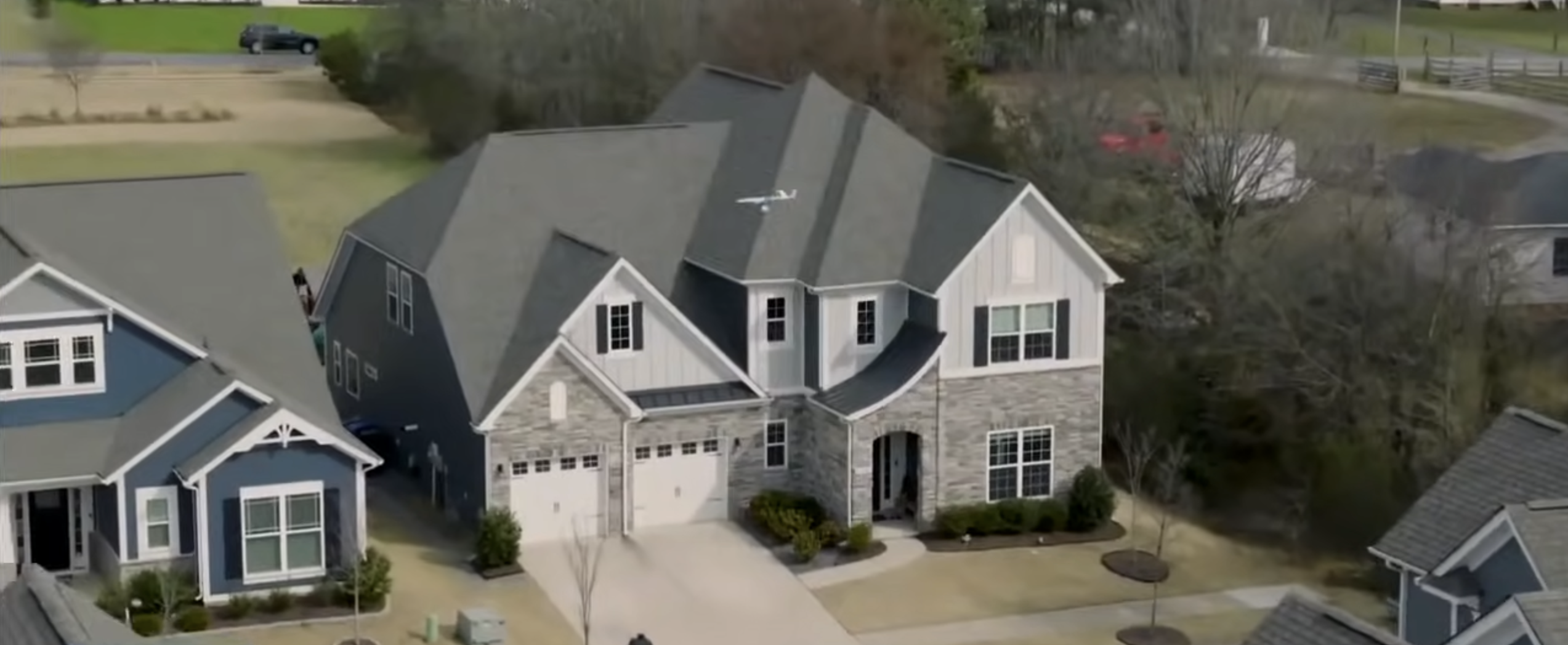 drone flying over house
