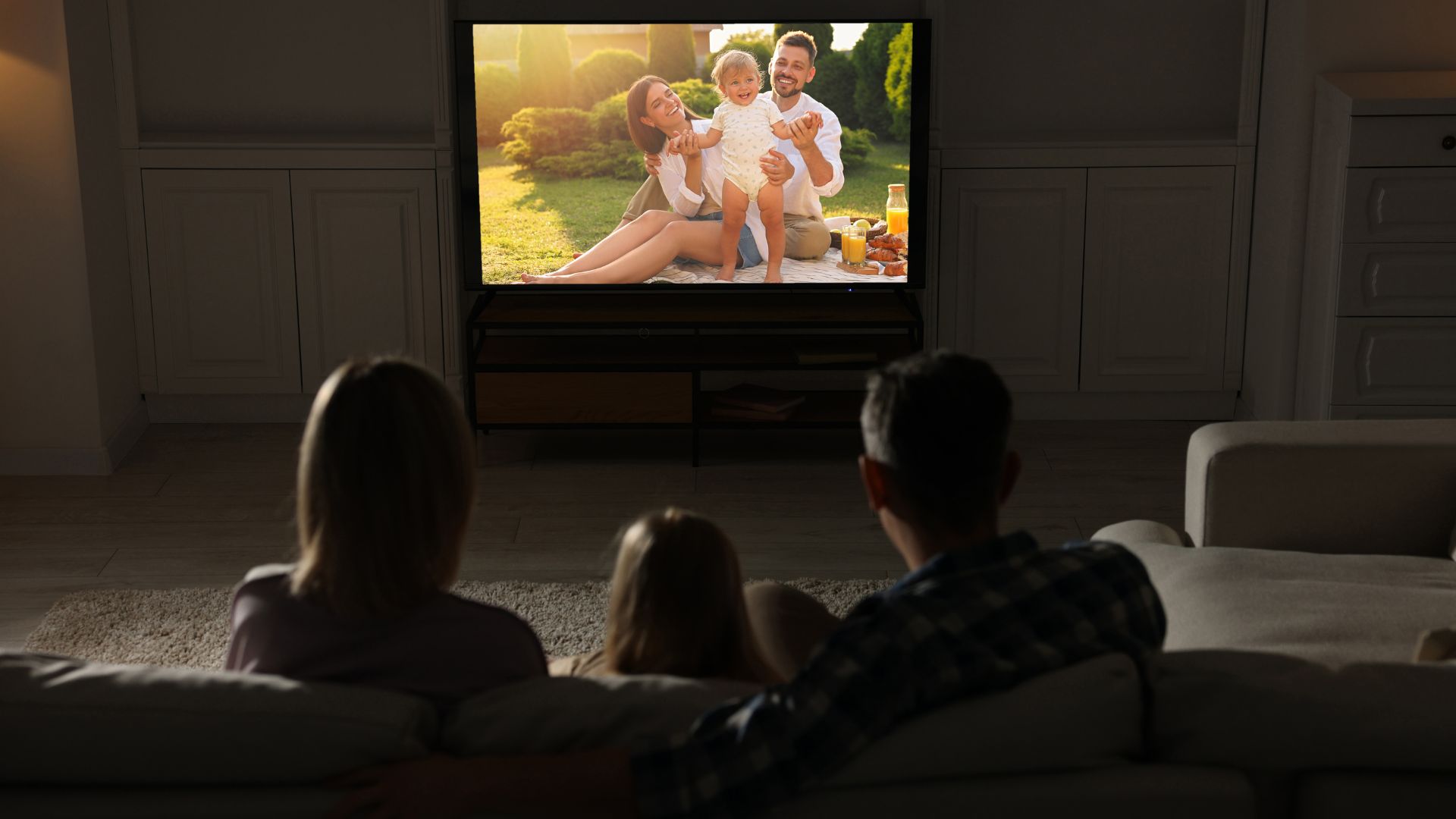 picture of family watching a movie