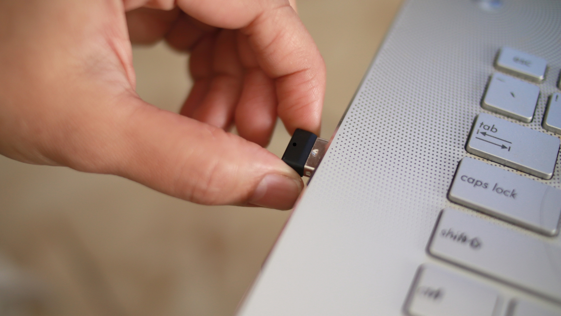 bluetooth dongle being put in computer