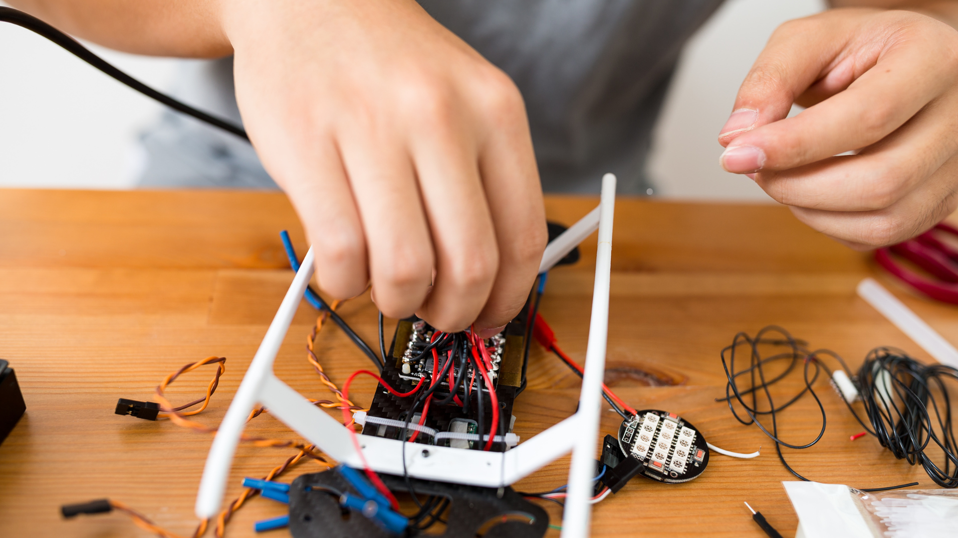 a man fixing a drone