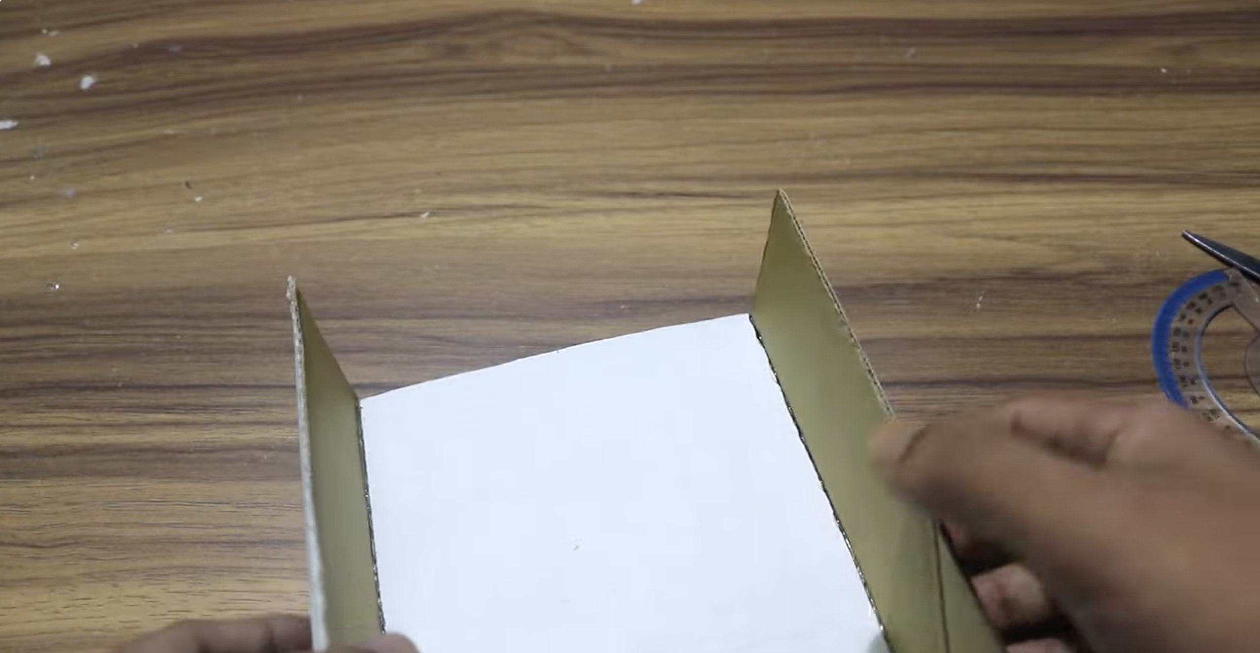 a cardboard box being cut