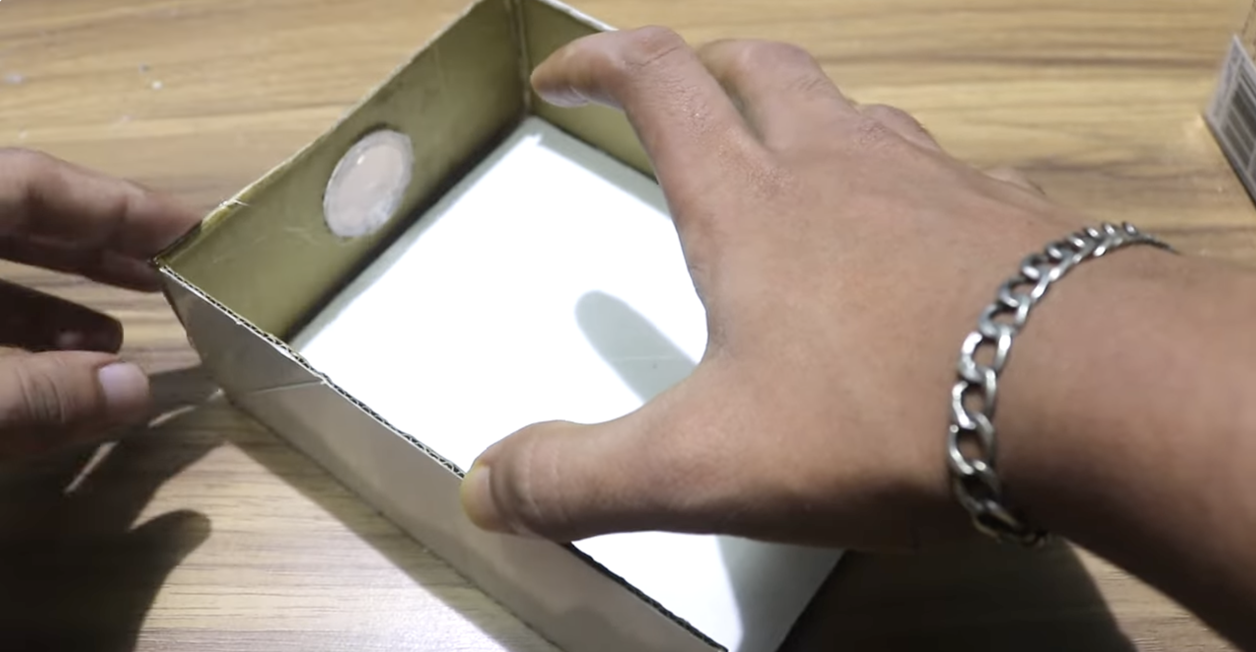 a man glueing box together