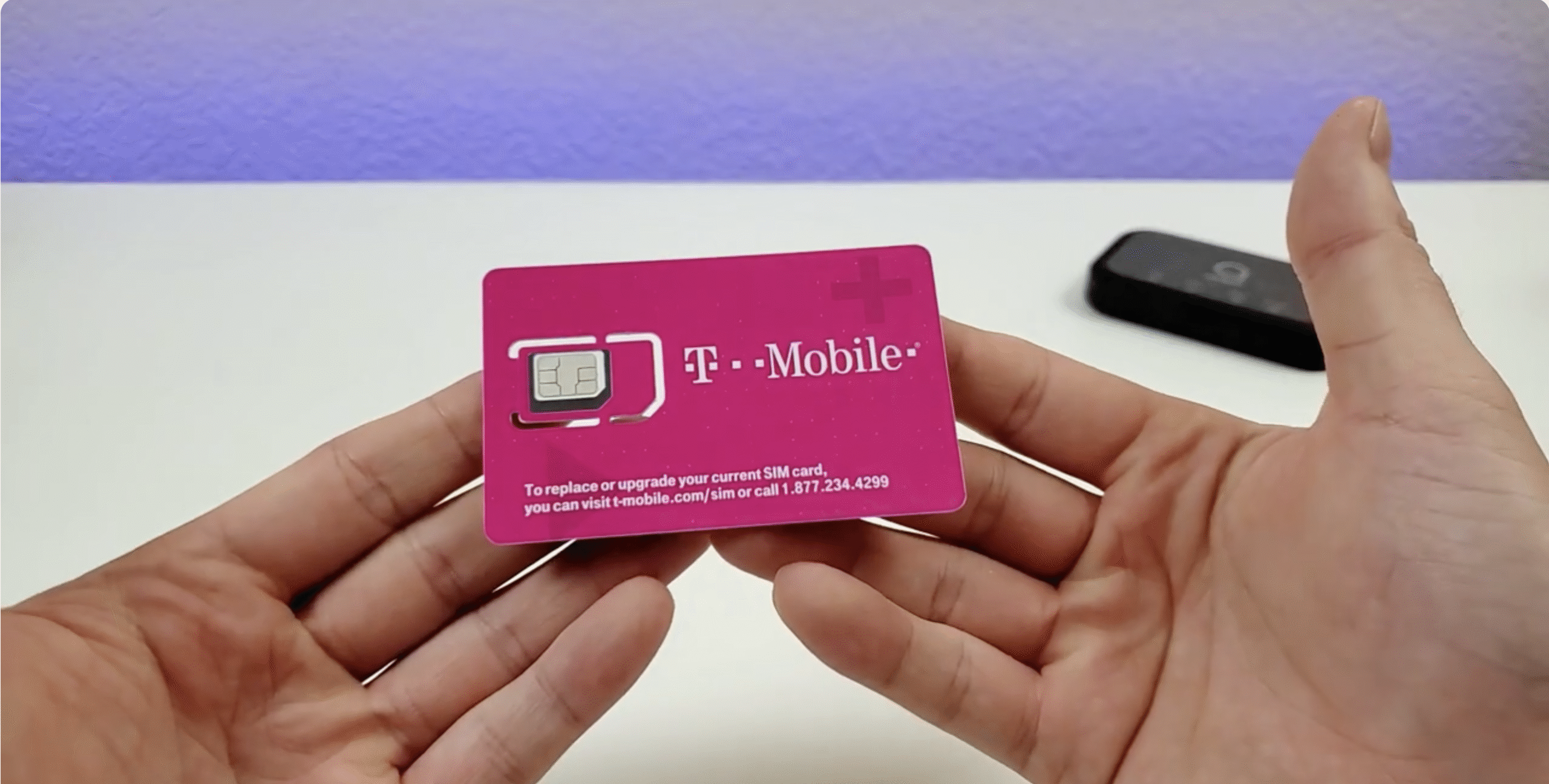 a man holding the sim pack