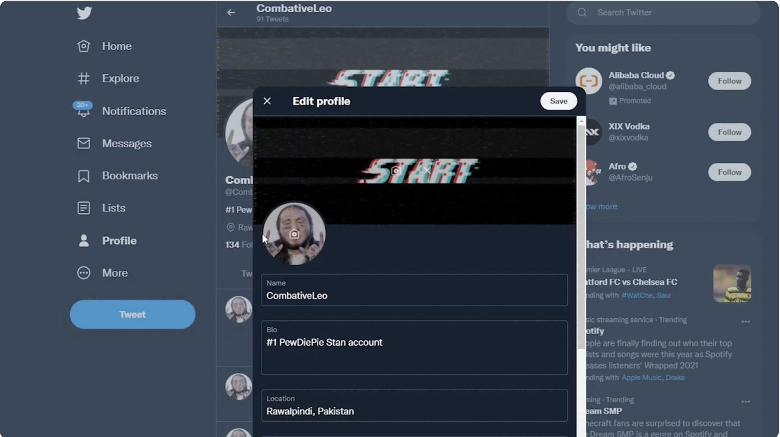 Twitter profile page on a laptop with the Edit Profile panel open and the user selecting Upload Photo for the profile picture