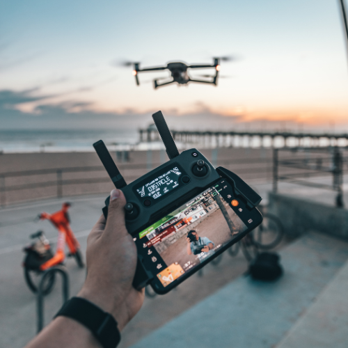 a drone controller with drone in flight